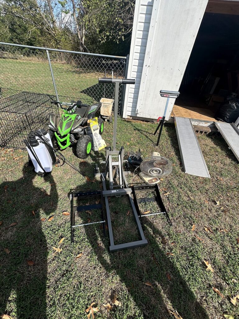 Kids' Raptor 12V ride-on ATV, mower lift jack, push spreader, tank sprayer and aluminum loading ramps