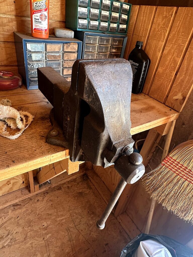 Large cast iron bench vise and small-parts organizer cabinets
