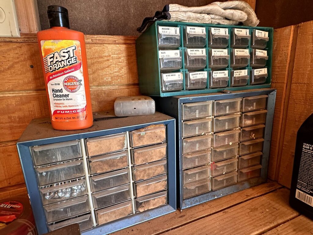 Metal parts organizer cabinets with nails, screws and washers