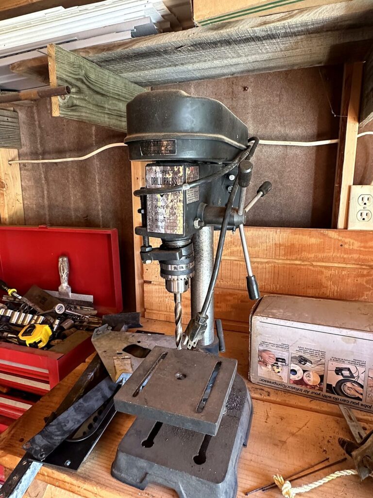 Benchtop drill press and tire inflator in box