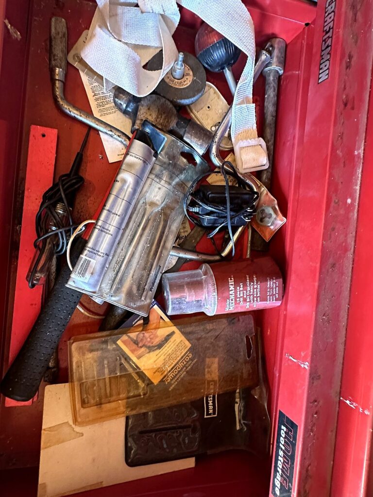 Tool chest drawer with hammer, grease gun and soldering iron