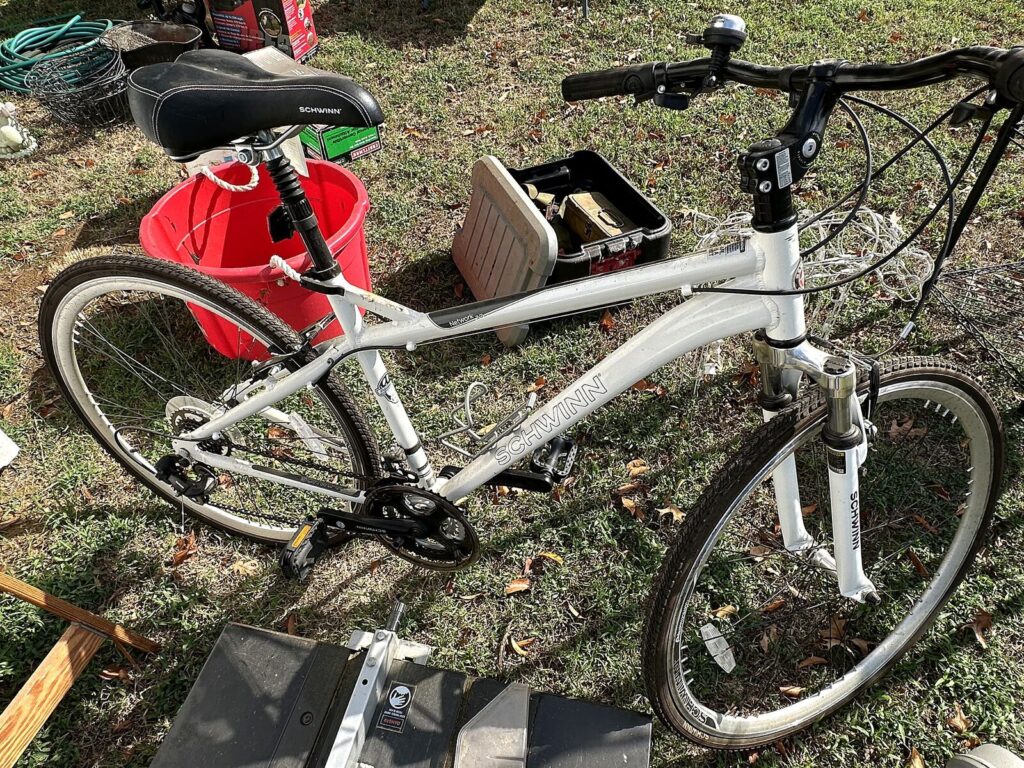 Schwinn hybrid bicycle and plastic toolbox