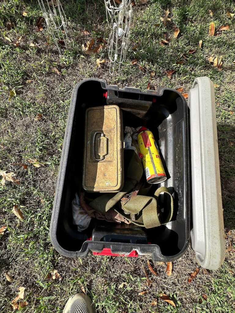 Storage tote with metal tackle box and ratchet straps