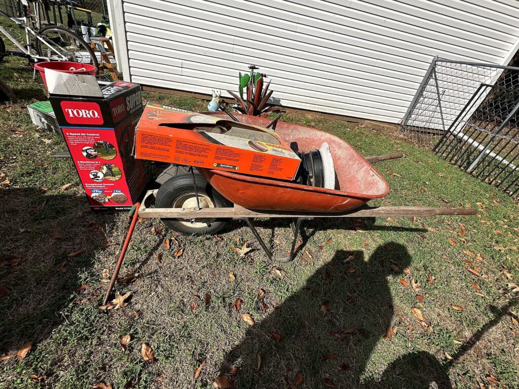 Wheelbarrow with Toro and Black & Decker boxes