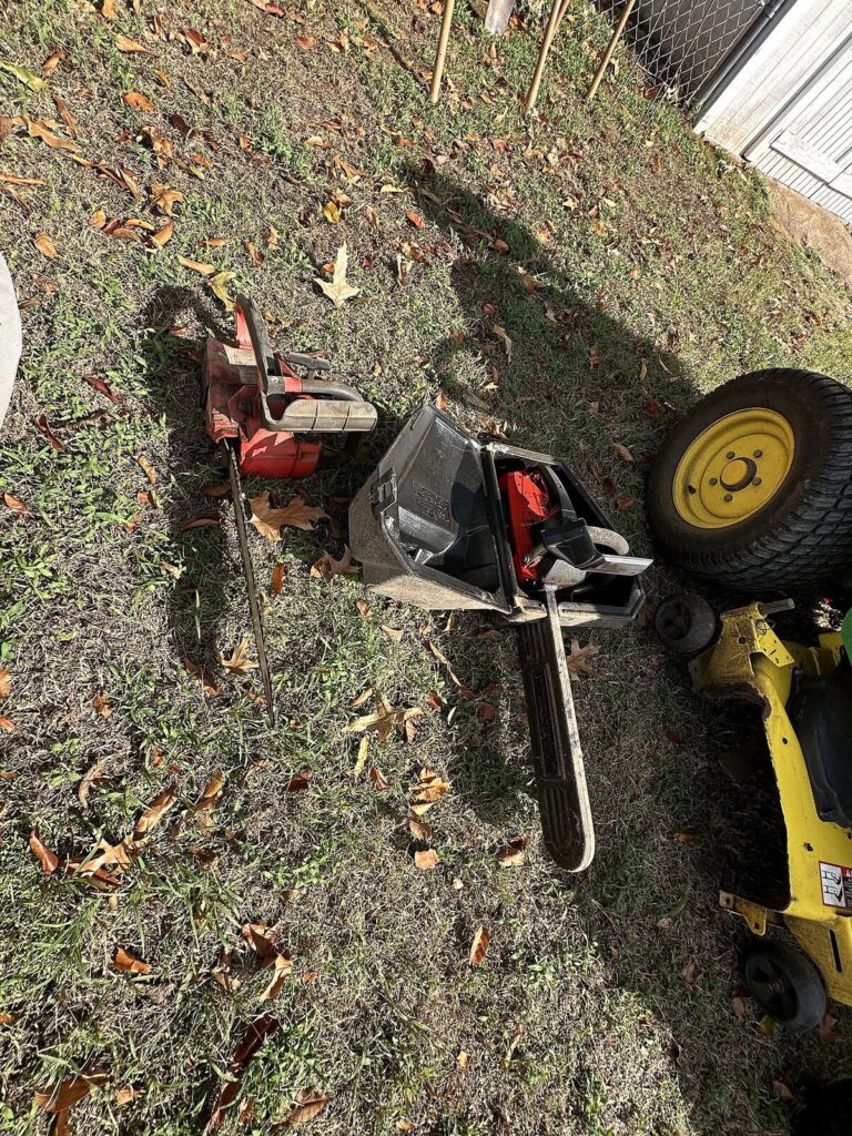 Two chainsaws, one with case