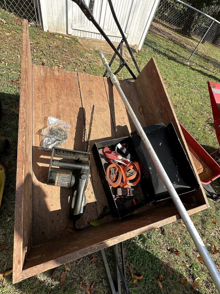 Homemade wood-bed yard cart, pole pruner and ratchet straps