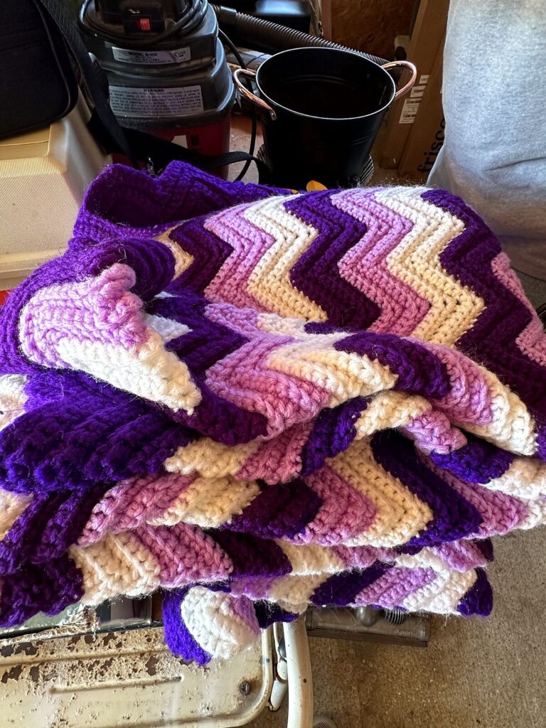 Crocheted purple chevron afghan