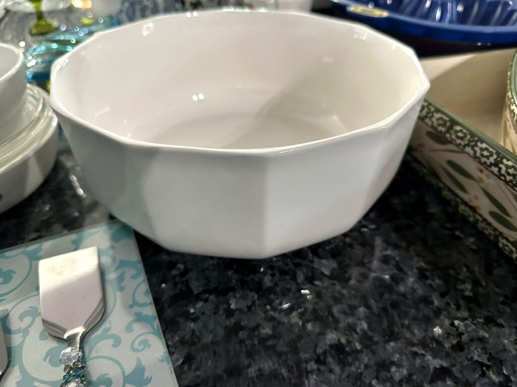 White octagonal serving bowl and beaded-handle serving utensils