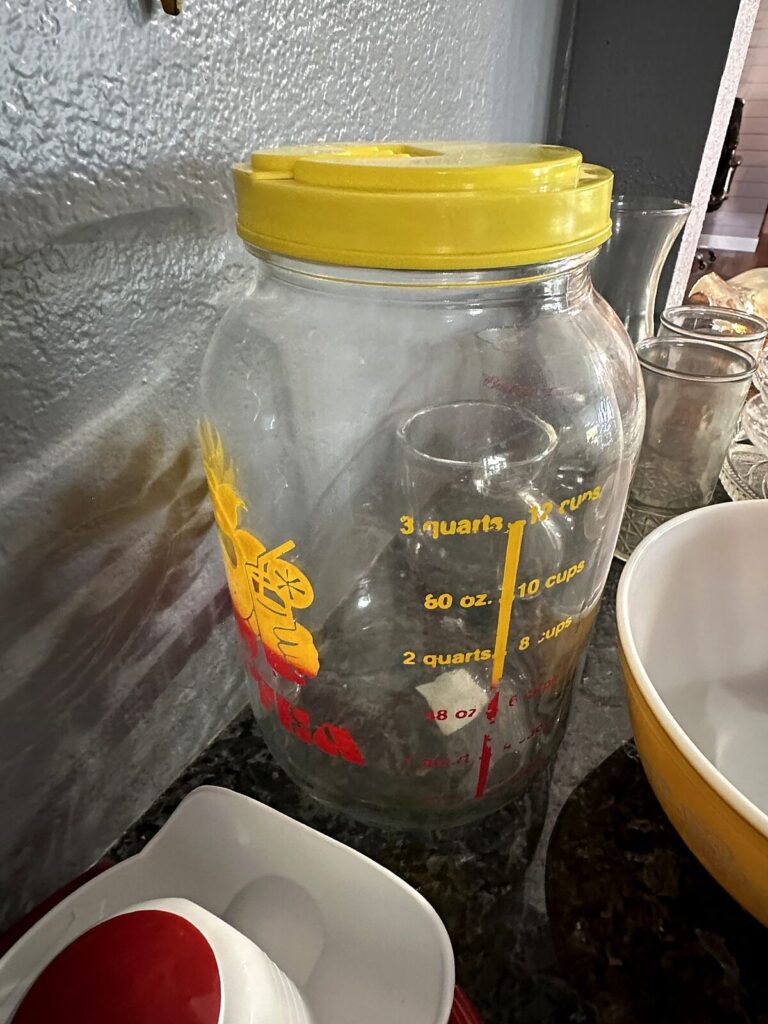 Vintage sun tea jar and yellow mixing bowl