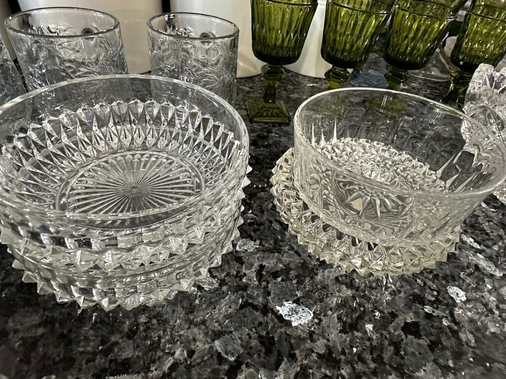 Pressed glass bowls and green glass goblets