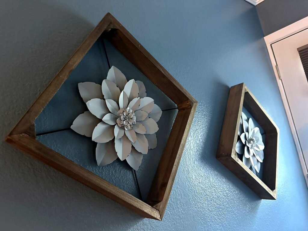 Wood-framed metal flower wall decor