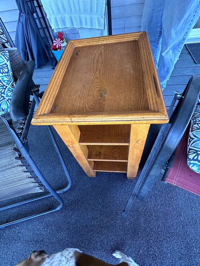 Oak end table and zero-gravity lounge chairs
