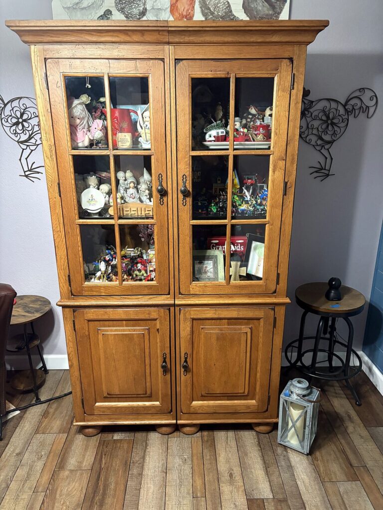 Tall oak display hutch with glass doors